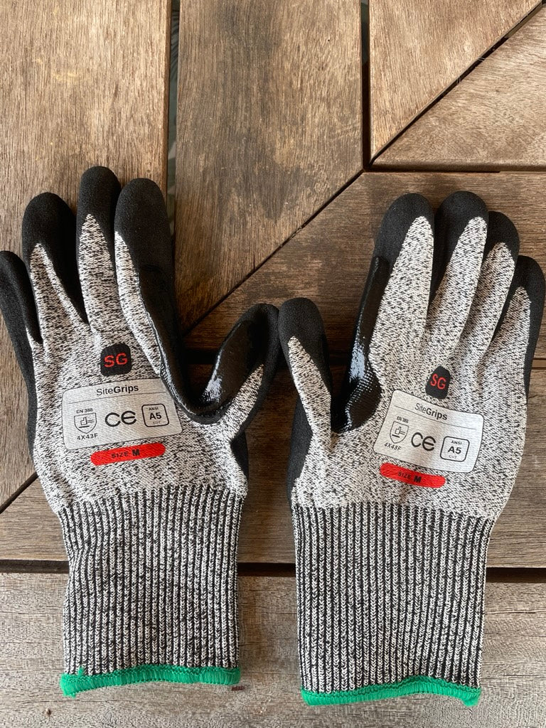 SiteGrips cut-resistant work gloves shown together with green and blue cuffs.