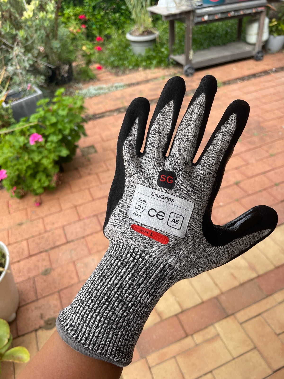 Close-up of the back and cuff of a SiteGrips cut-resistant glove.