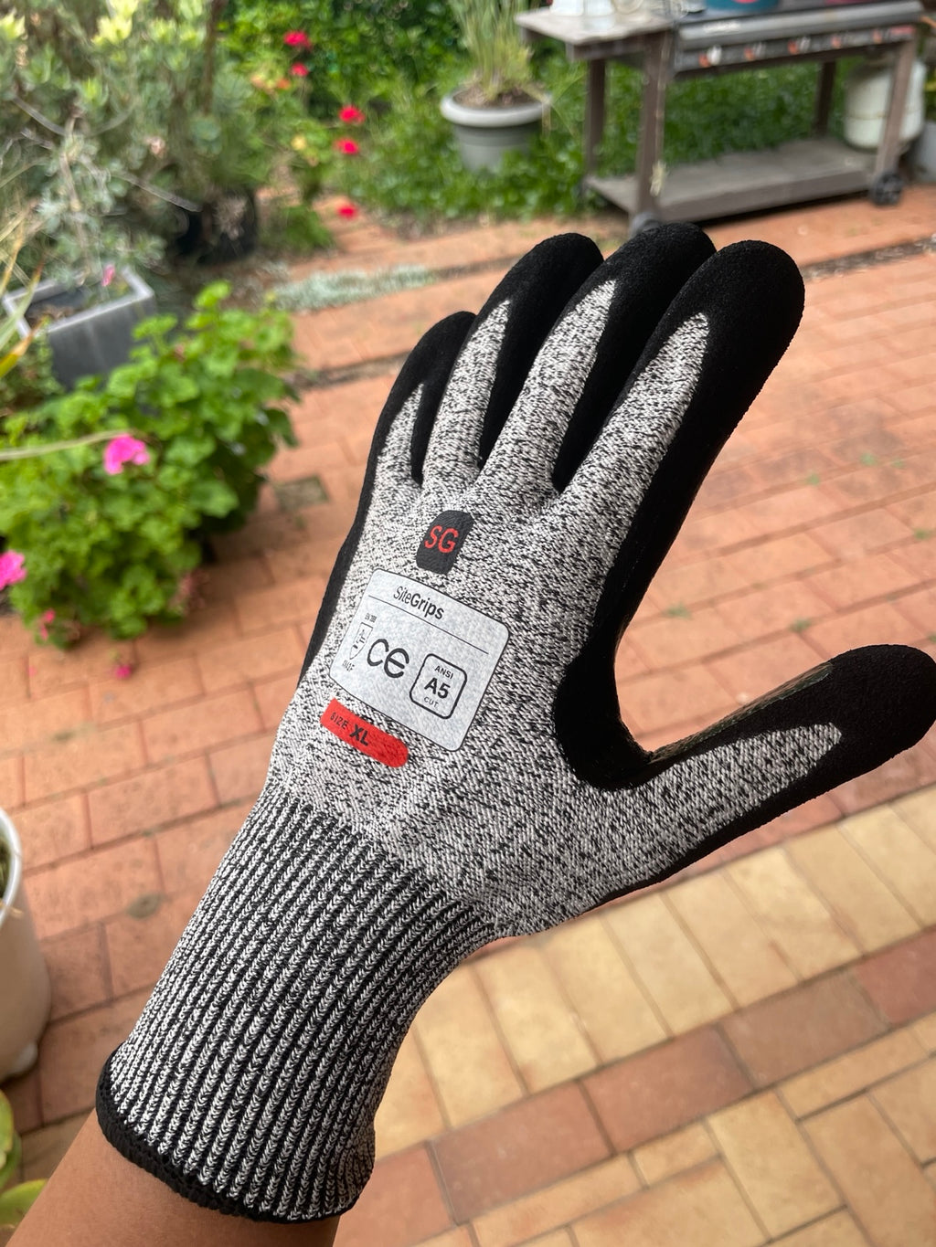 Angled close-up of the back and wrist cuff of a SiteGrips work glove.