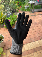 Palm side of a SiteGrips work glove showing the black coated fingers.